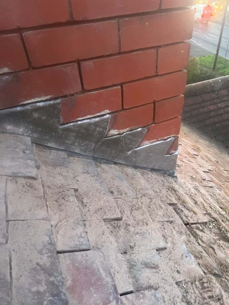 This is a photo of new leadwork being installed around an old chimney. Works carried out by Radford Roofing Repairs